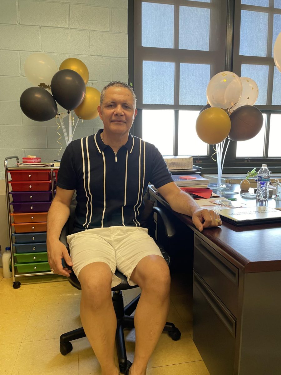 Mr. Miesas at his desk at PS 218